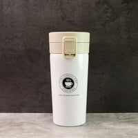Close-up of  stainless steel vacuum insulated coffee flask showing specifications