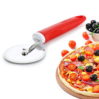 Ganesh pizza cutter in action, smoothly slicing a freshly baked pizza.
