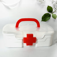 Side view of the portable medicine storage box, highlighting its compact design and integrated carrying handle.