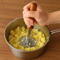 Side view of the GripChef Paubhaji Masher, highlighting its sturdy handle.