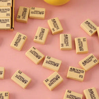 A rectangular bright yellow 4B eraser ready for school or office tasks.