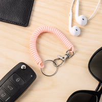 Flexible plastic spiral keychain bracelet offering hands-free convenience