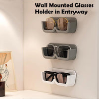 Demonstration of the sunglasses holder installation, highlighting its strong adhesive backing.