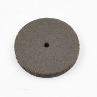Detailed view of a single durable resin grinder cutting disc for metalwork.