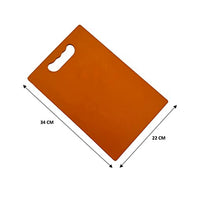 Hygienic plastic chopping board with a comfortable grip for easy handling.