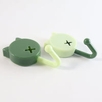 Sticky adhesive base of self adhesive round wall hooks showing strong adhesive pad