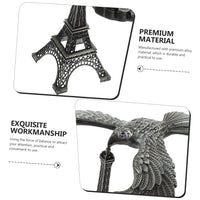 The Balancing Eagle Toy displayed on a modern wooden desk, adding a unique and intriguing accent to the workspace.