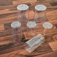 Lifestyle image of the Ganesh Classic plastic glasses set being used in a home setting.