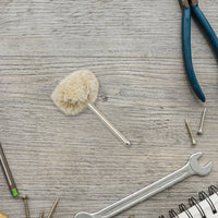 Detailed view of the soft yet effective cotton polishing wheel material.