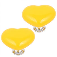 Assortment of colorful heart-shaped cabinet knobs in various shades.