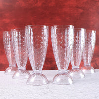 Milkshake glass highlighting footed base and diamond-cut crystal texture