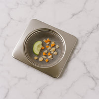 Detailed close-up of stainless steel mesh filter for sink drain