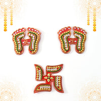 Assorted Laxmi Charan and Swastik decals in bright hues for Diwali décor