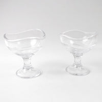 Clear glass dessert bowl highlighting its sturdy footed base.
