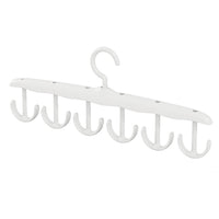 Side view of the space-saving tank top hanger with garments, showcasing its slim profile.