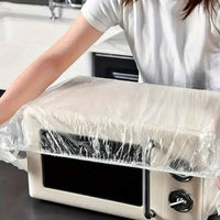 Elasticated plastic couch protector securely fitted over a sofa.