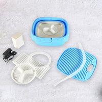 Portable washing machine shown folded for easy storage and space-saving.