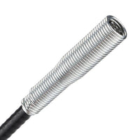 Stainless steel drain cleaning brush coiled for compact storage.