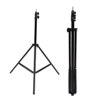 Portable DSLR camera tripod folded for easy transport, highlighting its lightweight design.