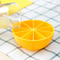 ChillPour bright green flexible lemon-shaped silicone ice cube tray in kitchen
