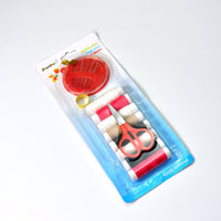 Organized sewing kit with thread, needles, and measurement tape for home use.
