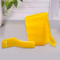 The CookAura 6-piece plastic soup bowl and spoon set neatly stacked, ready for storage.