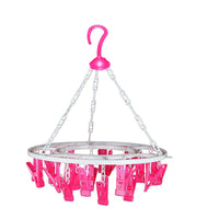 Multicolour round drying stand with 24 clips for efficient garment drying.
