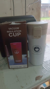 Alternative angle of  vacuum insulated coffee flask with flip lock lid