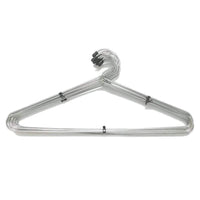 Stack of space-saving stainless steel hangers, highlighting their slim profile for closet organization.