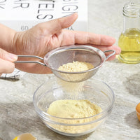 Tea strainer in use for kitchen straining