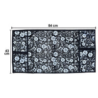 Microwave dust cover with an elegant design protecting a kitchen appliance.