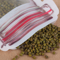 A 500ml reusable plastic pouch filled with nuts, showcasing its self-standing design.