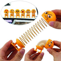 Multiple angles of the smiling face shaking head doll, highlighting its expressive features.