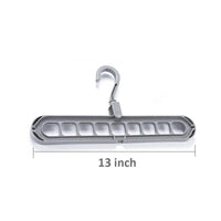 Close-up view of the nine precisely designed holes on the plastic hanger for secure garment storage.