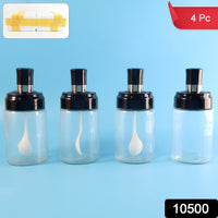 Set of four clear spice storage bottles with built-in spoons and airtight lids