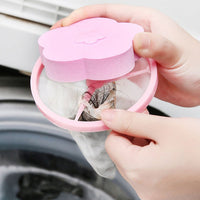 A hand demonstrating how to remove collected lint from the filter bag.