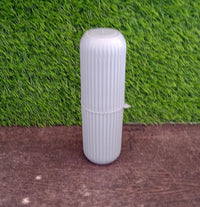 Textured capsule-shaped travel storage bottle from Organivo for secure grip.