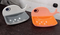 Top-down view of the wall mounted soap holder with a bar of soap, ready for use.