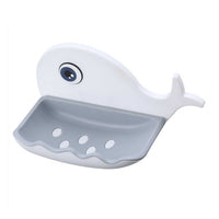 A wall-mounted fish shape soap dish in a bathroom setting, demonstrating its practical use.