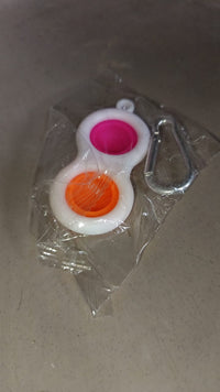 Pop It style fidget toy keychain, a fun sensory item.