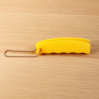 Compact Silicone Bag Carrier conveniently attached to a keyring for easy access.
