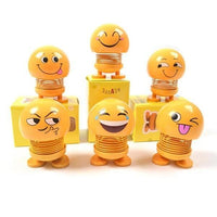 Collection of various smiling face spring toys, showcasing their playful design.