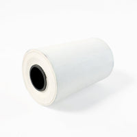 Close-up view of thermal label roll showing label texture
