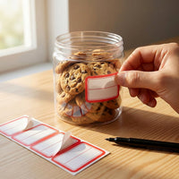 Red and white self-adhesive label stickers displayed on white background