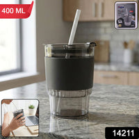 Transparent plastic tumbler with a secure lid and eco-friendly reusable straw.