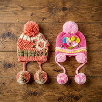 Kids winter hat with fun design and pom-pom detail