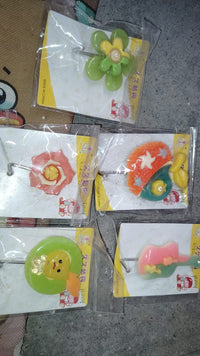 Multipurpose frog-shaped self-adhesive wall hook enhancing bathroom organization.