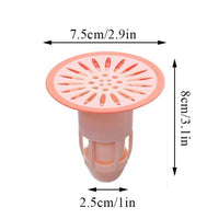 Effective hair trap plug made of silicone, shown in a kitchen sink to prevent food debris.